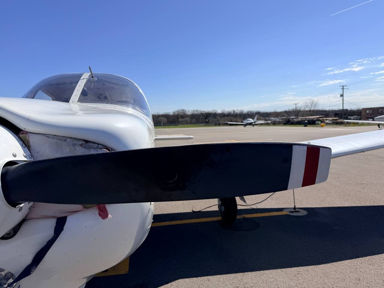 Piper Arrow trainer on the ramp at DuPage Airport showing wing surface condition before detailing
