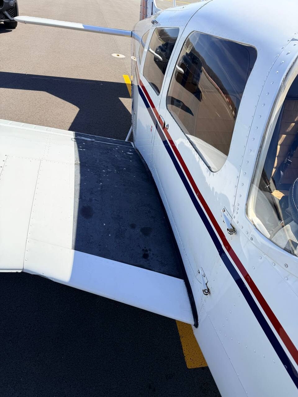 Before: grip step peeling requiring resurfacing on the Piper Arrow