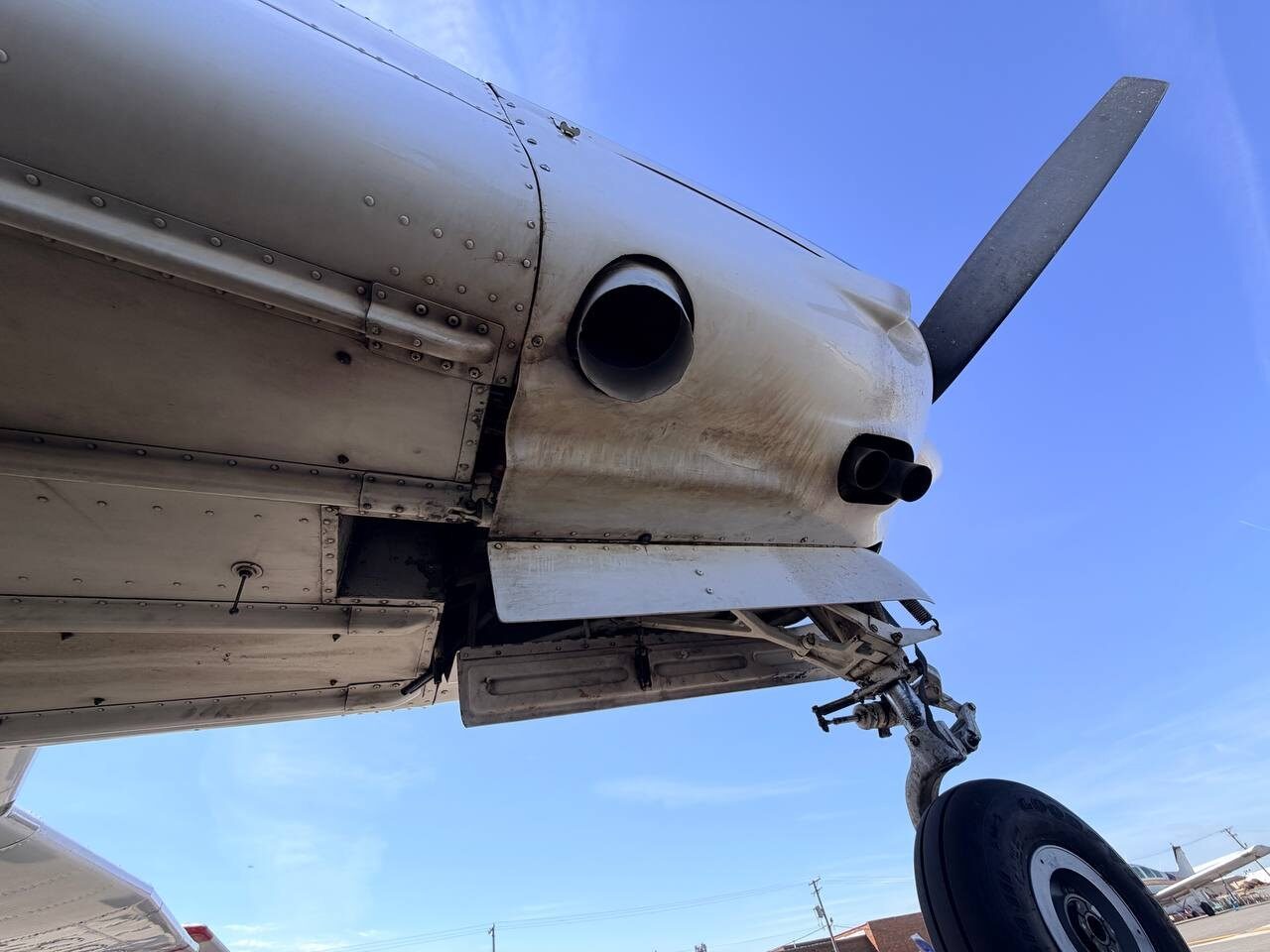 Before: grease accumulation around Piper Arrow landing gear and engine belly