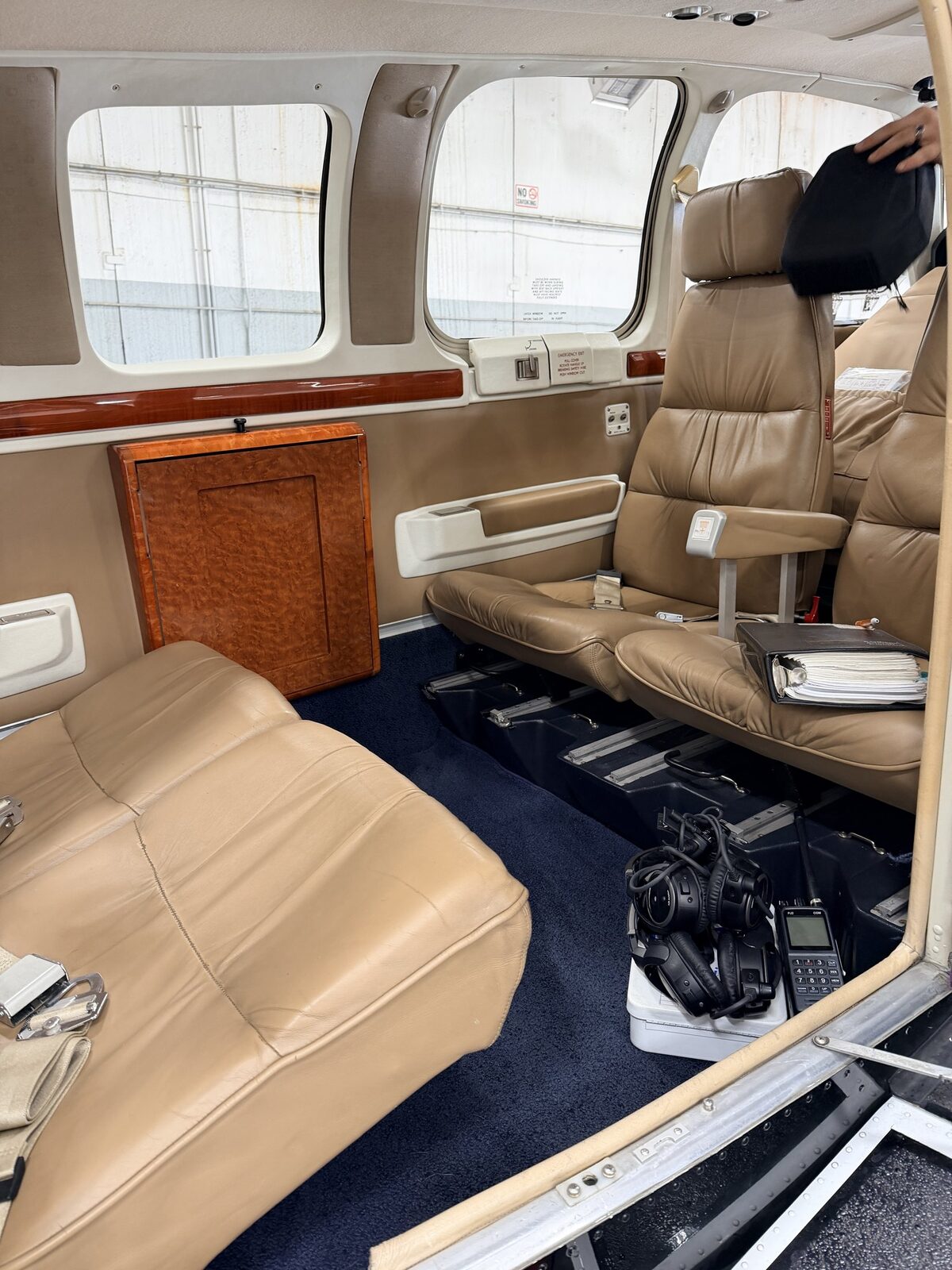 After: Baron 58 cabin seating reset with leather conditioned and seatbelts organized