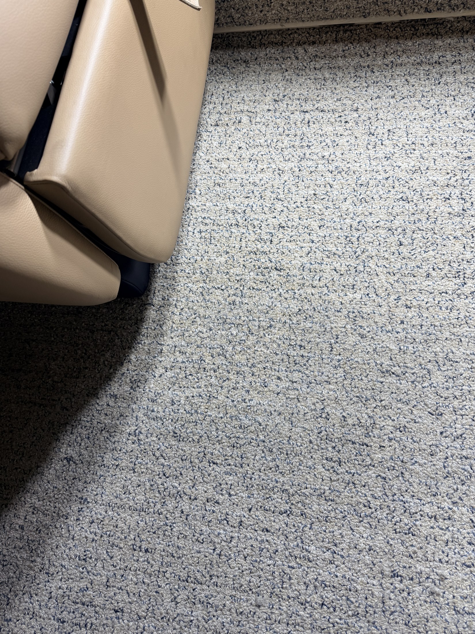 After: under-seat carpet area following extraction on the Challenger 300