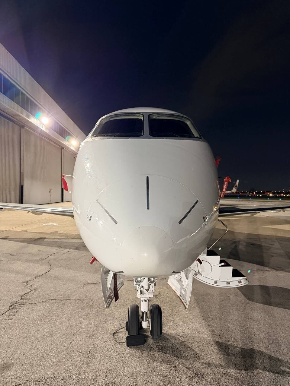 Bombardier Challenger 350 nose-on view staged for overnight detail at Chicago Midway MDW