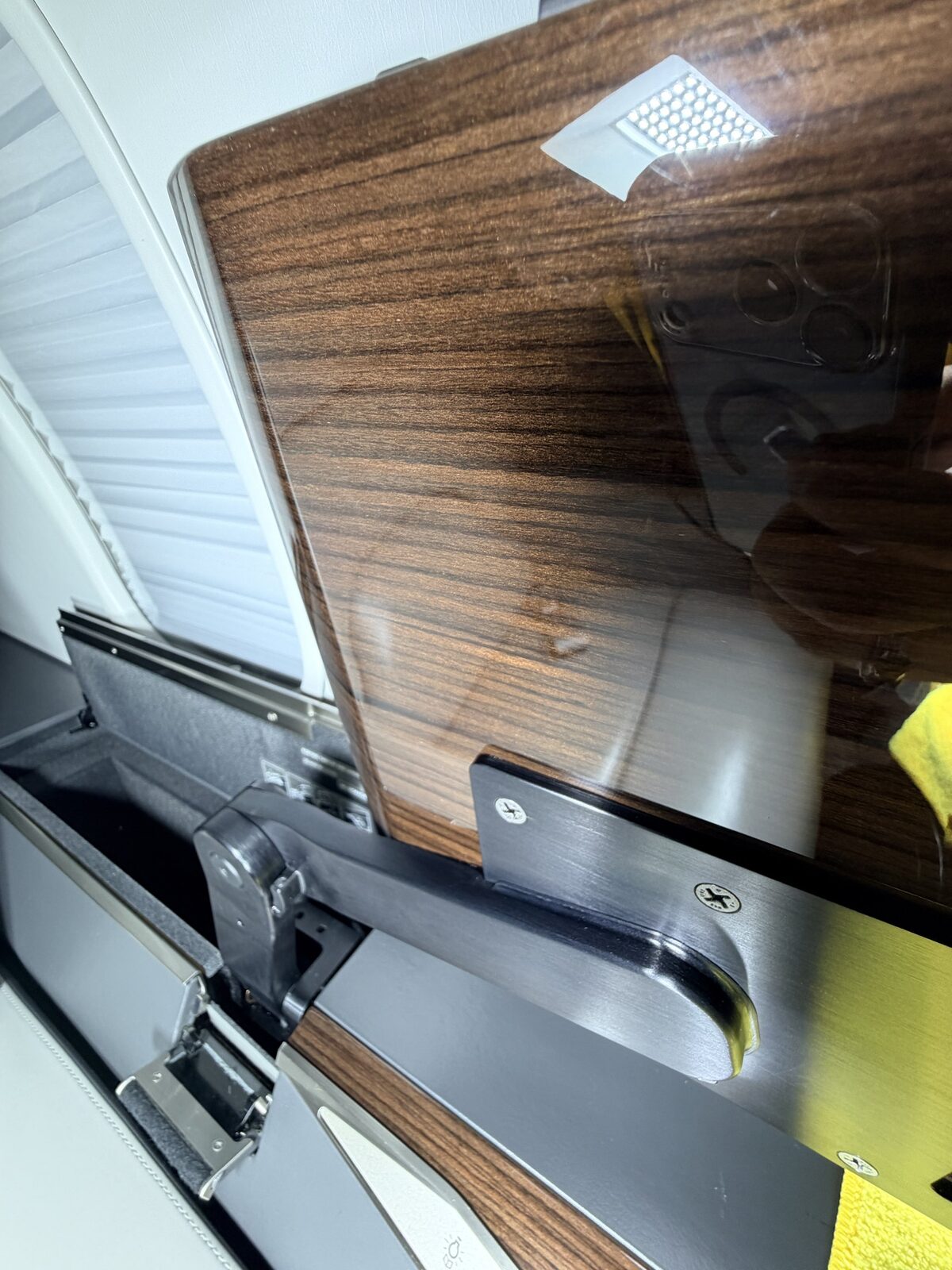 After: tray table area reset with clean veneer surface