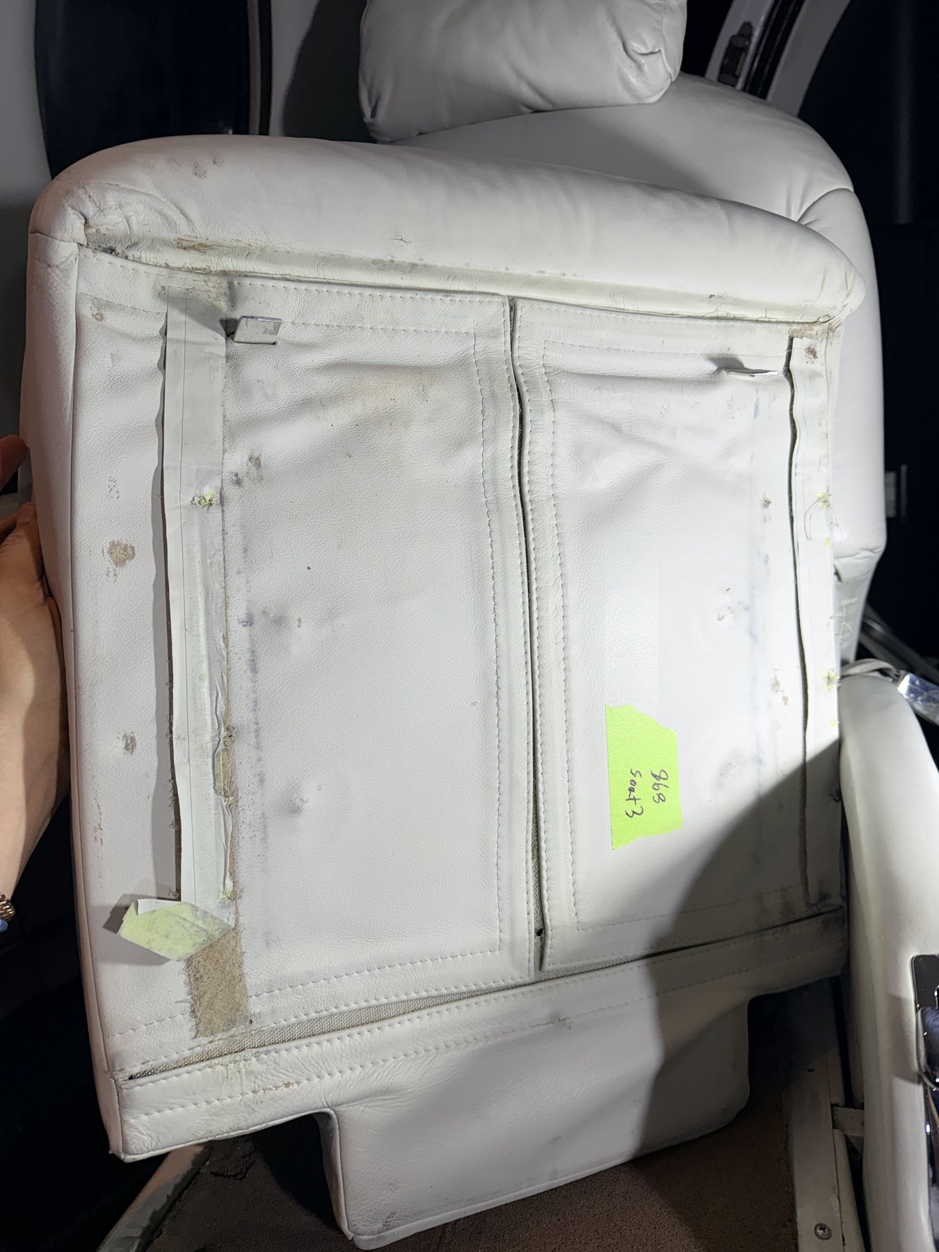 Before: lower passenger seat underside and adjacent carpet condition on Citation Excel