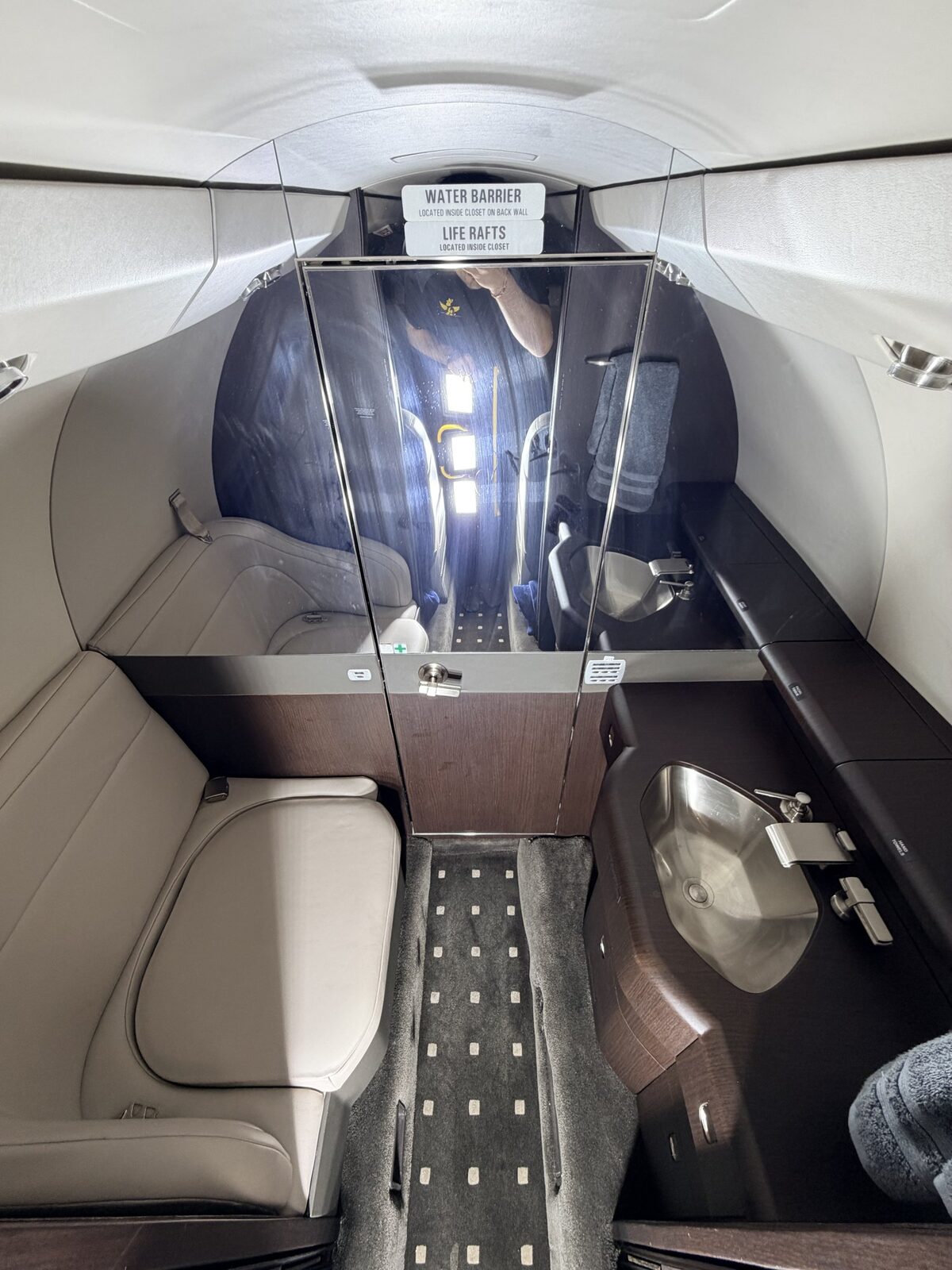 Before: Cessna Citation X cabin aisle and rear seating area showing use-related buildup