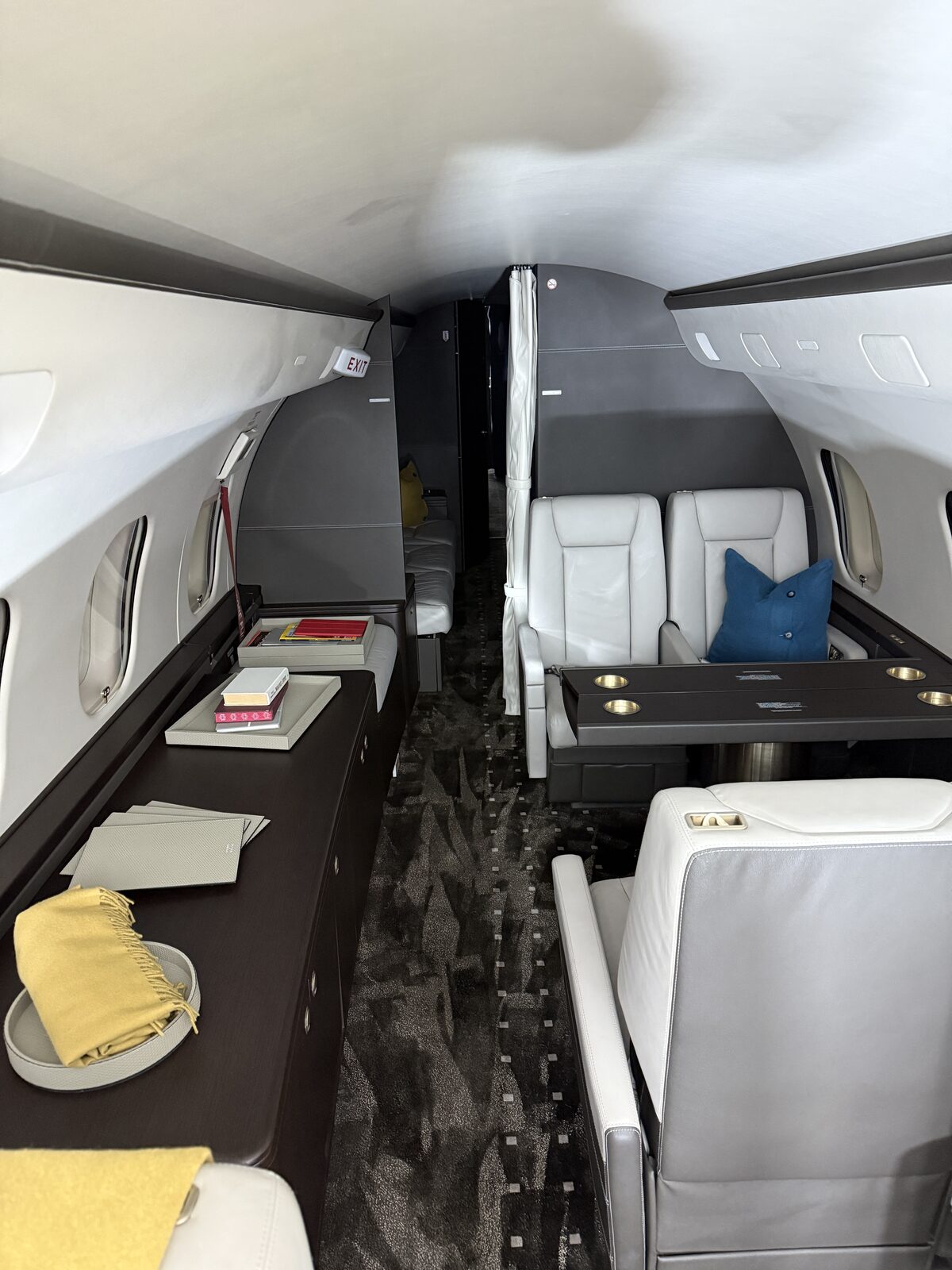 After: forward executive seating area and Giobagnara leather accessories reset on Global 5000