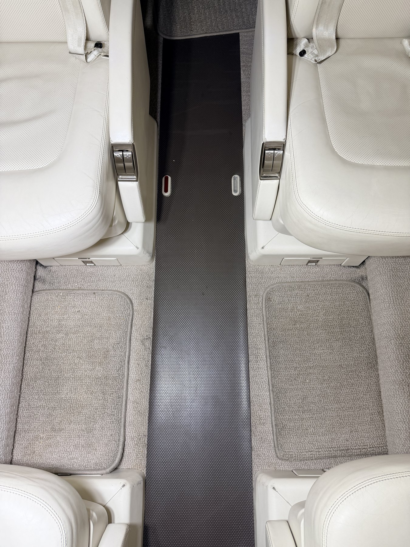 Before: aisle carpet and seat-adjacent floor zones before extraction on Learjet 75