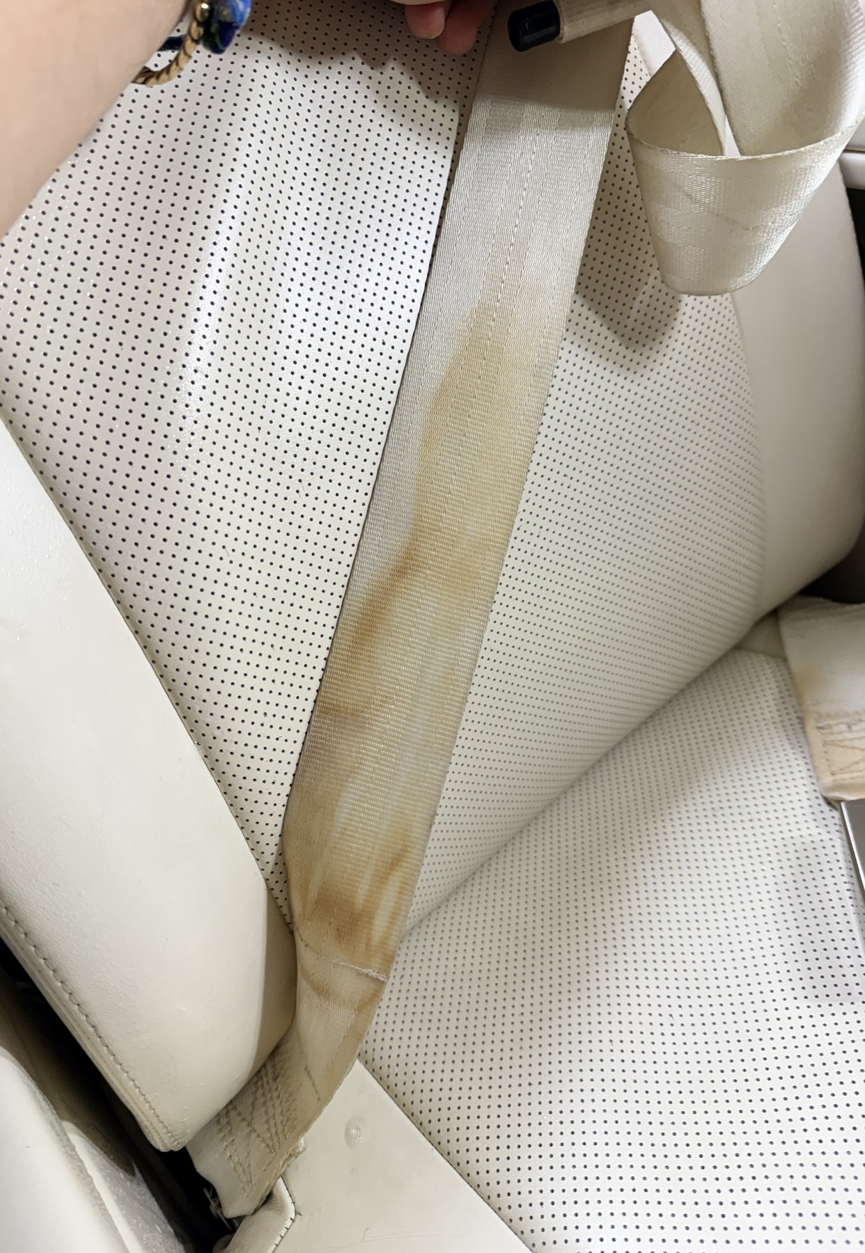 Before: seatbelt webbing with visible residue and high-use transfer