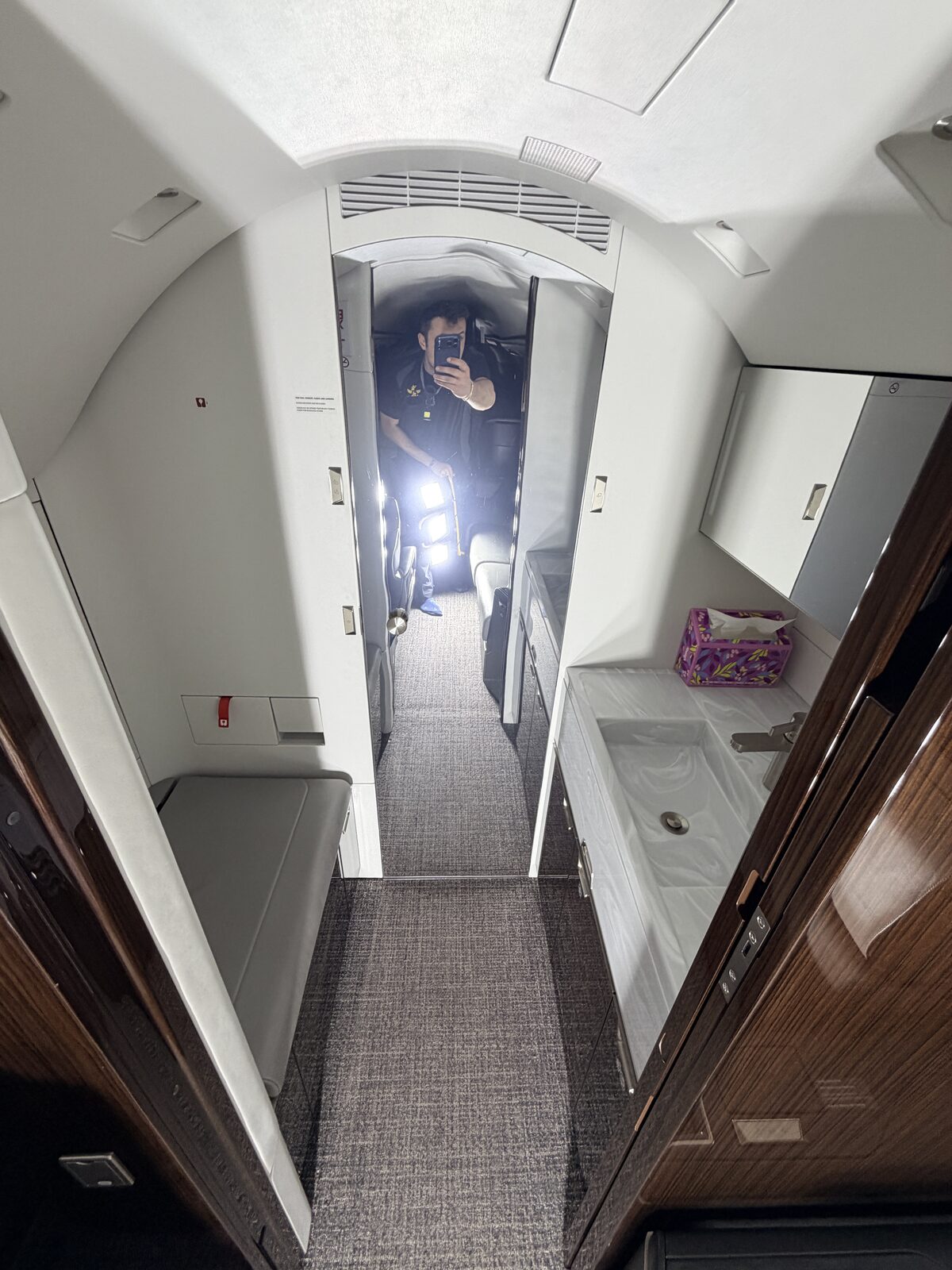 Bombardier Challenger 350 interior aft lavatory vanity mirror wood veneer tissue box detailing