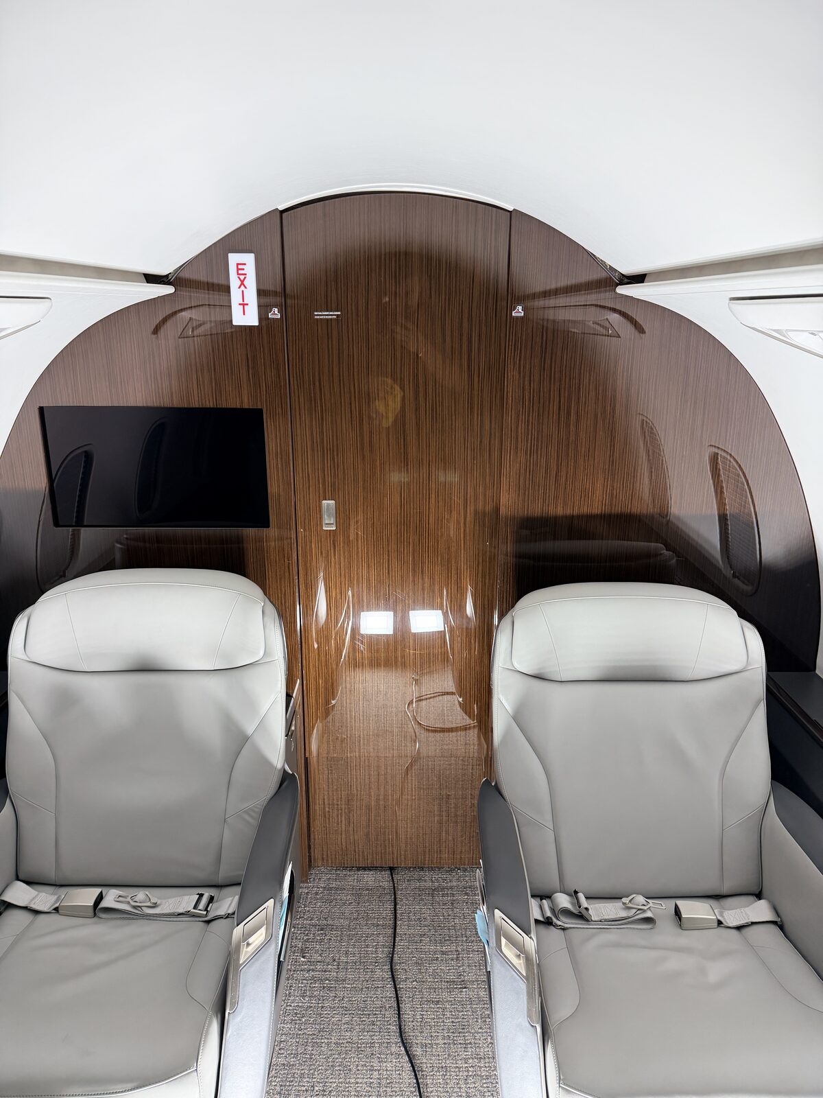 Bombardier Challenger 350 interior club seats polished wood executive table EXIT sign detailing