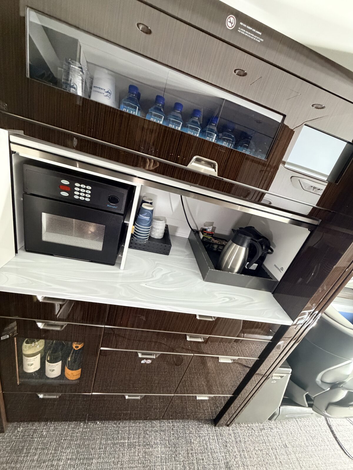 Bombardier Challenger 350 interior galley water bottles oven coffee maker wine rack detailing Chicago