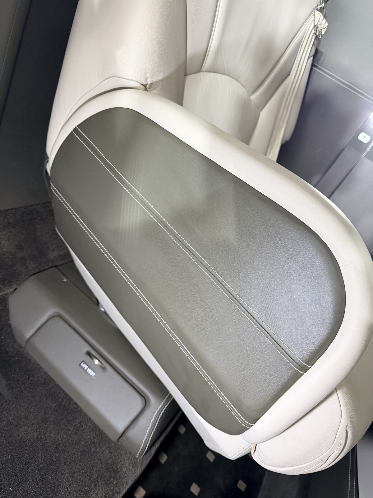 Cessna Citation X interior seat back grey leather panel white contrast stitching life vest pocket detailing
