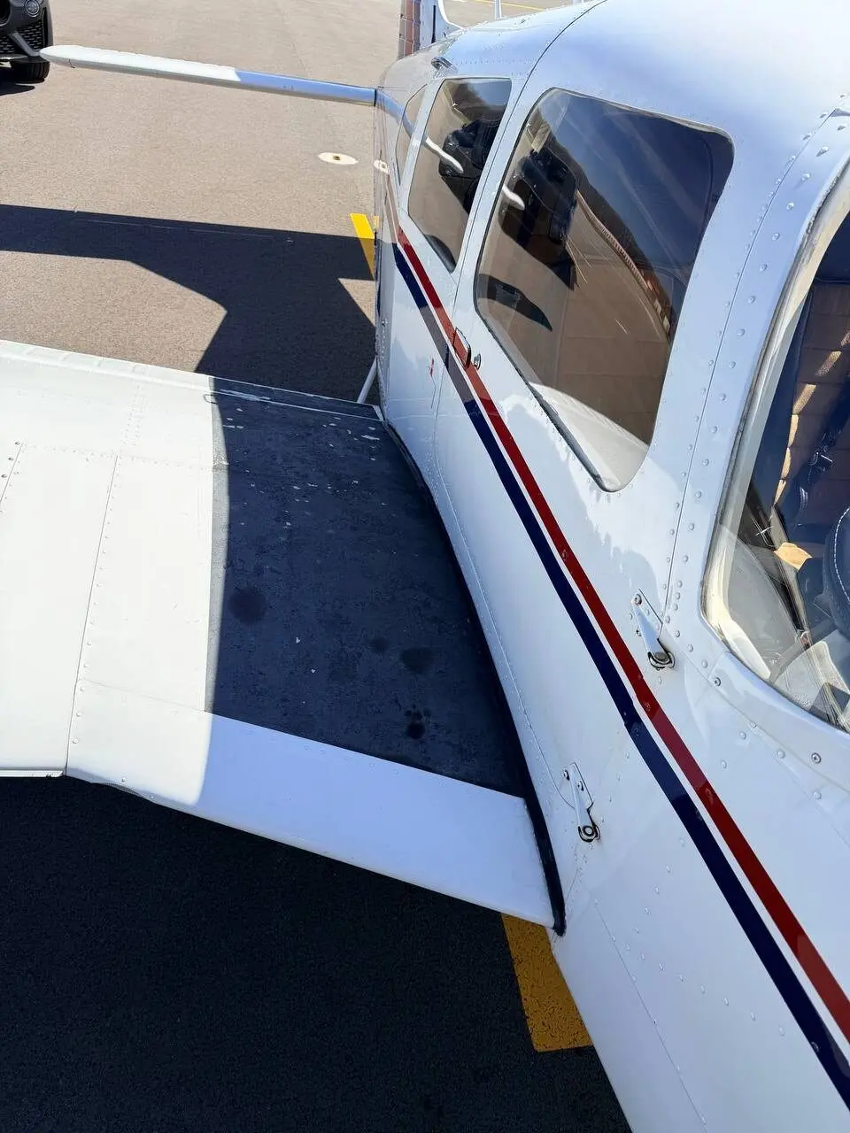 Before: grip step peeling requiring resurfacing on the Piper Arrow