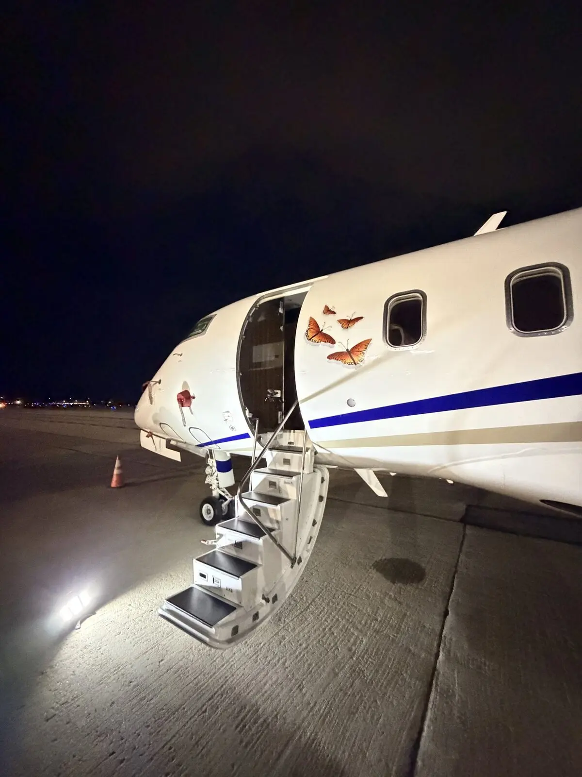 Bombardier Challenger 300 night-ramp entry reference at Milwaukee Mitchell before interior service