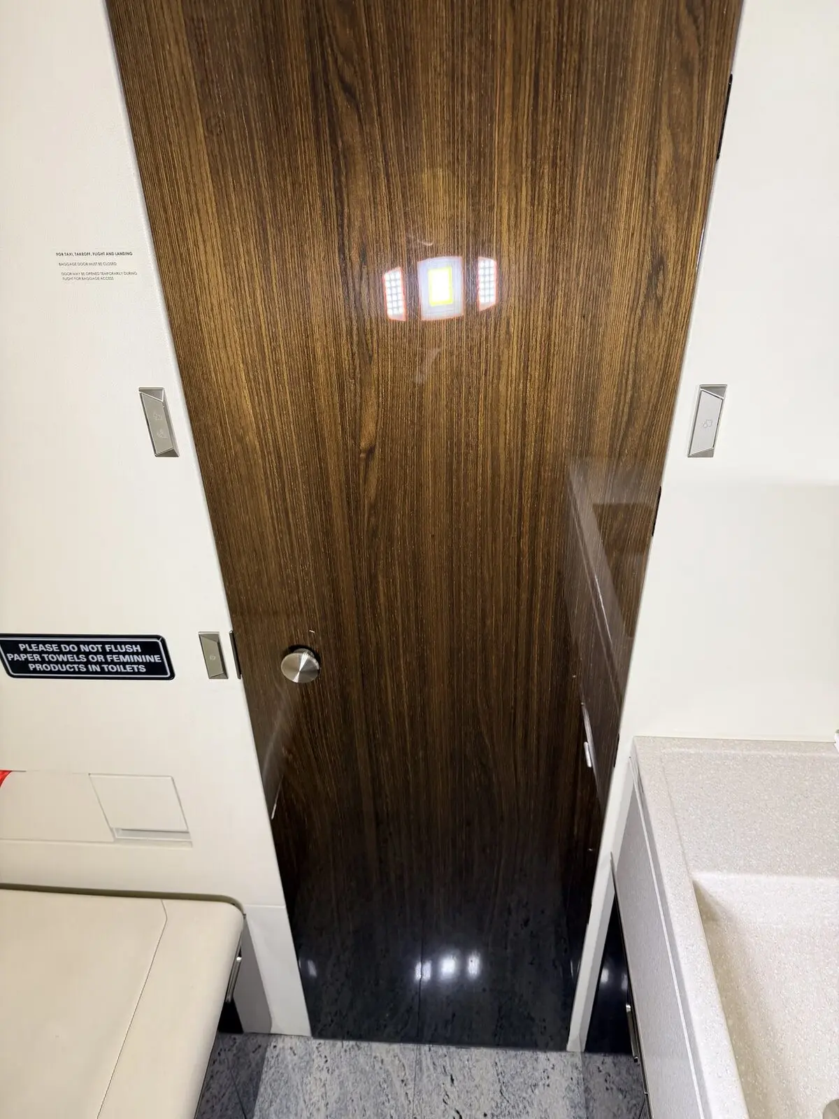 After: forward bulkhead and lavatory-entry area reset on Challenger 300