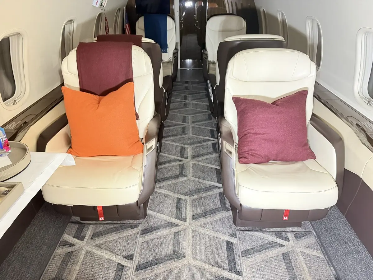 After: aft cabin seating and carpet presentation reset on Challenger 300