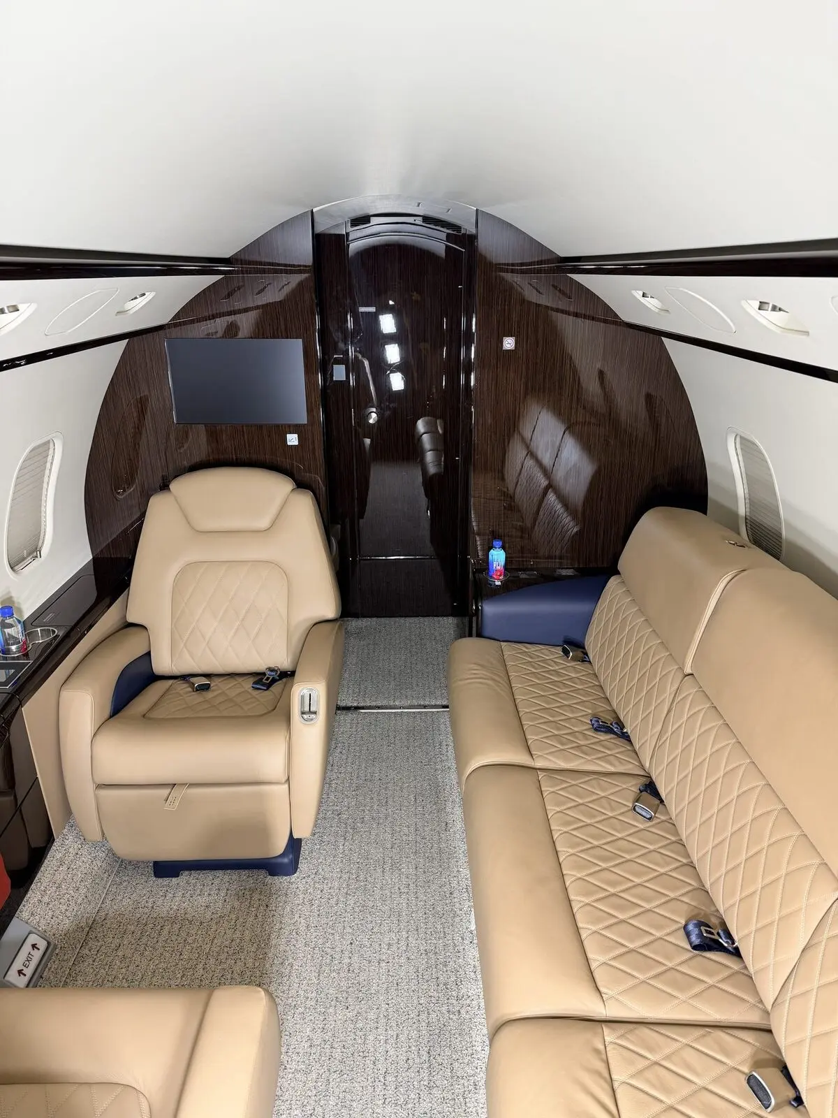 After: forward cabin carpet, seating, and woodwork presentation on the Challenger 300