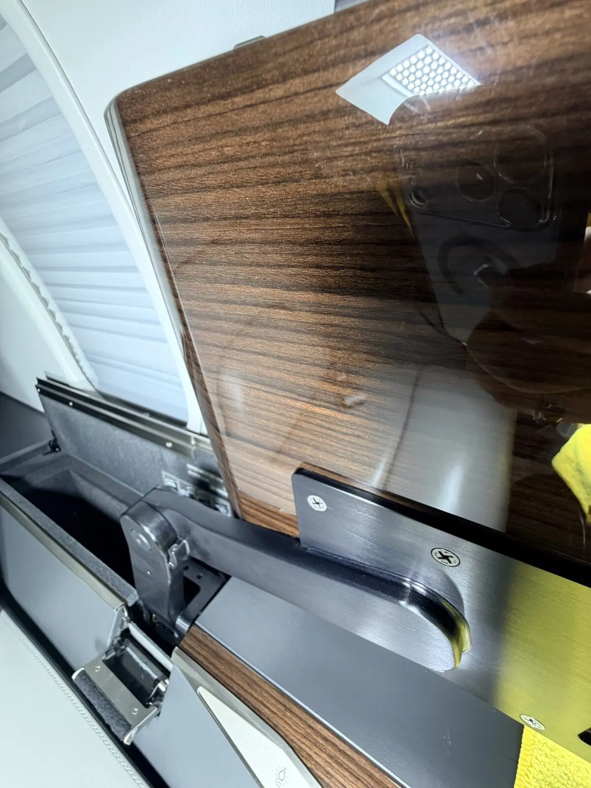 After: tray table area reset with clean veneer surface