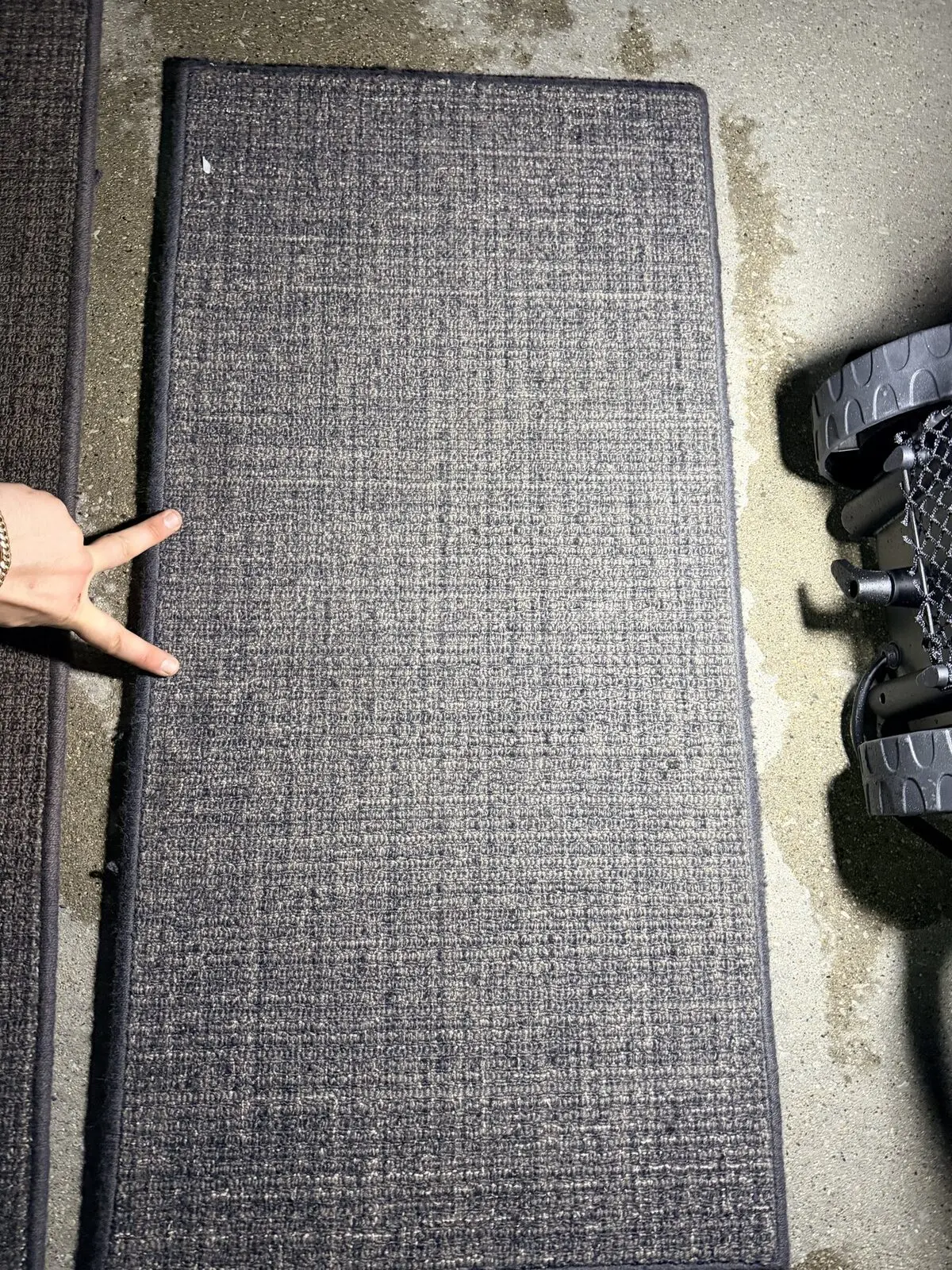 Before: removable cabin carpet with visible spot staining on Challenger 350