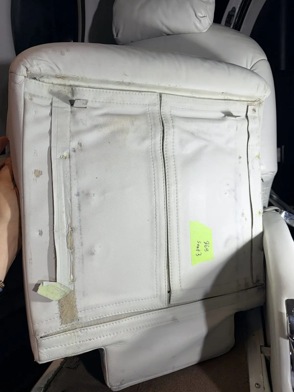 Before: lower passenger seat underside and adjacent carpet condition on Citation Excel