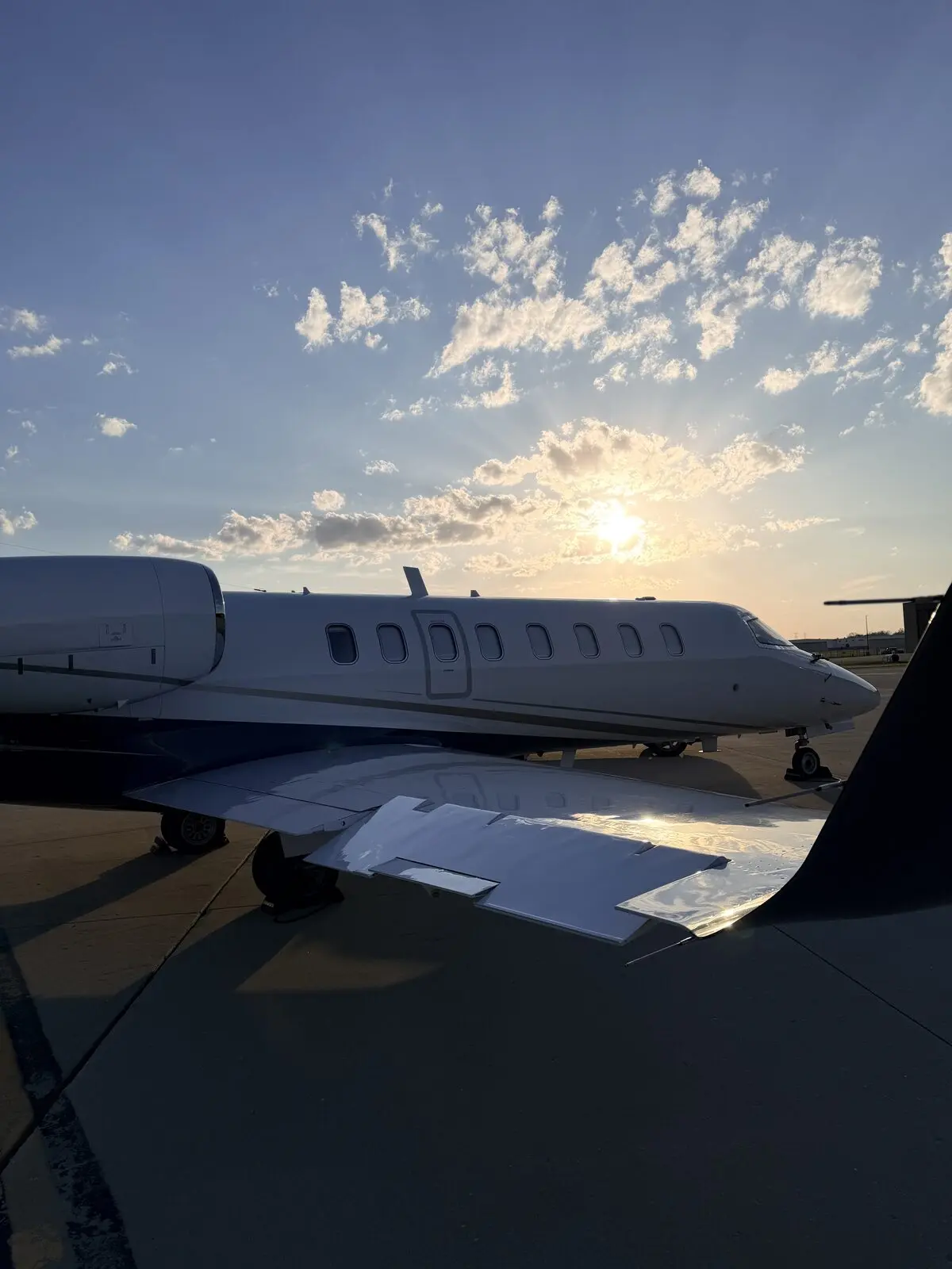 Learjet 75 on the ramp at Chicago Executive Airport at sunset following interior detail and carpet cleaning