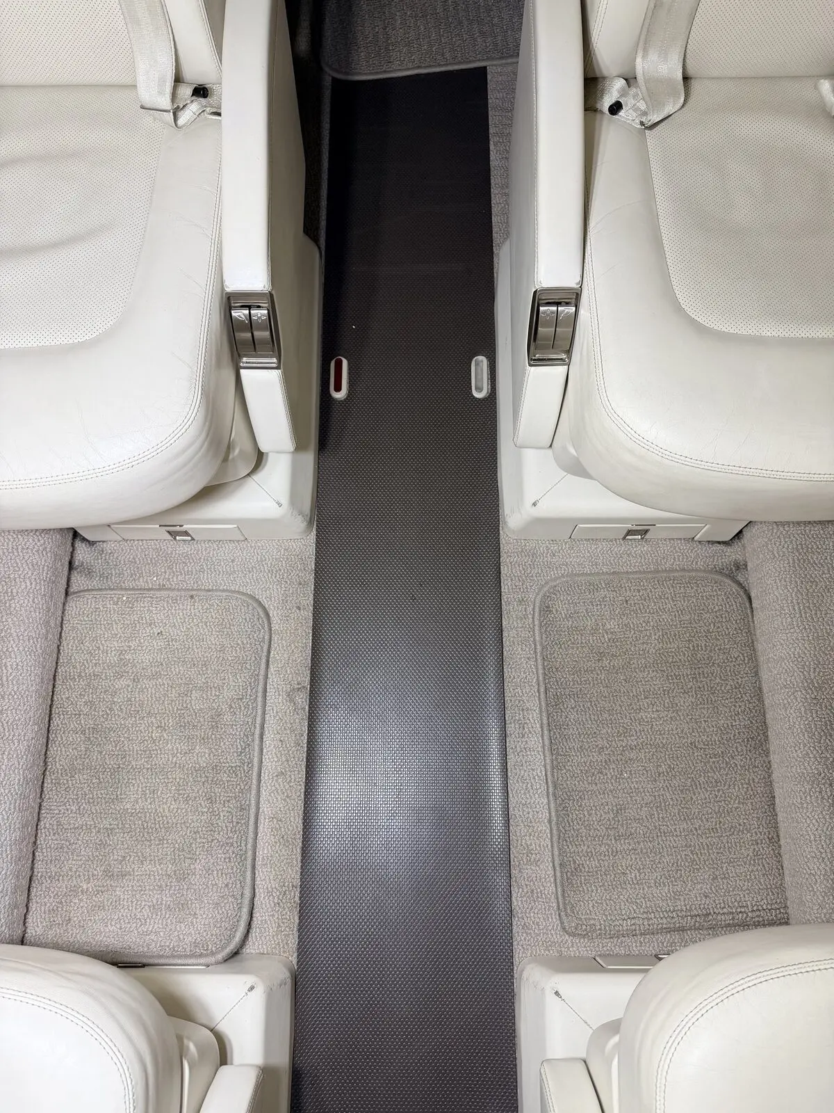 Before: aisle carpet and seat-adjacent floor zones before extraction on Learjet 75