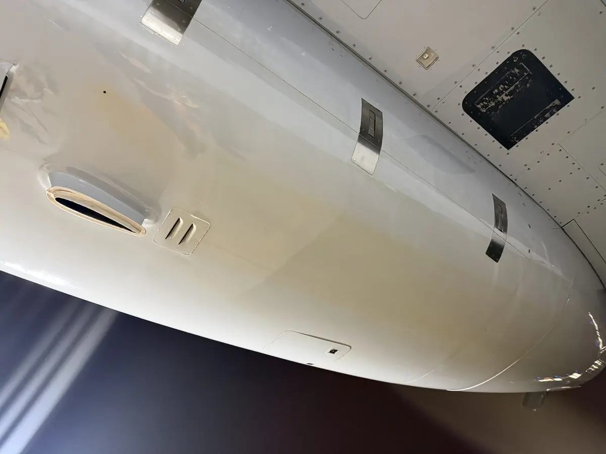 Cessna Citation X belly panel and service access doors after degreasing and exterior detail showing clean underside
